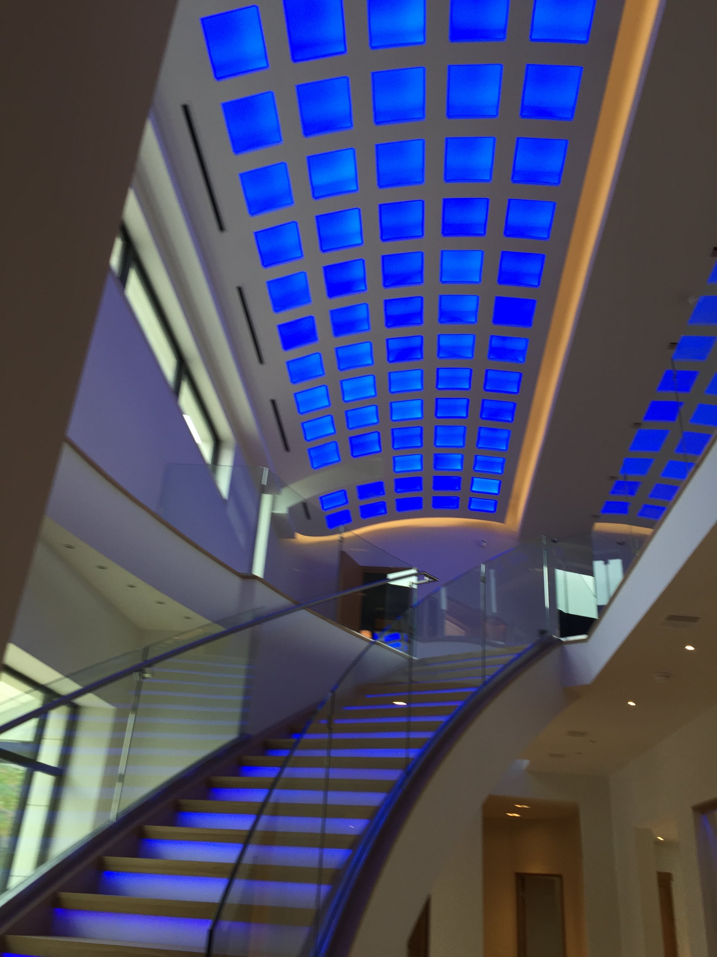 Symmetrical Golden-Lit Corridor & Foyer